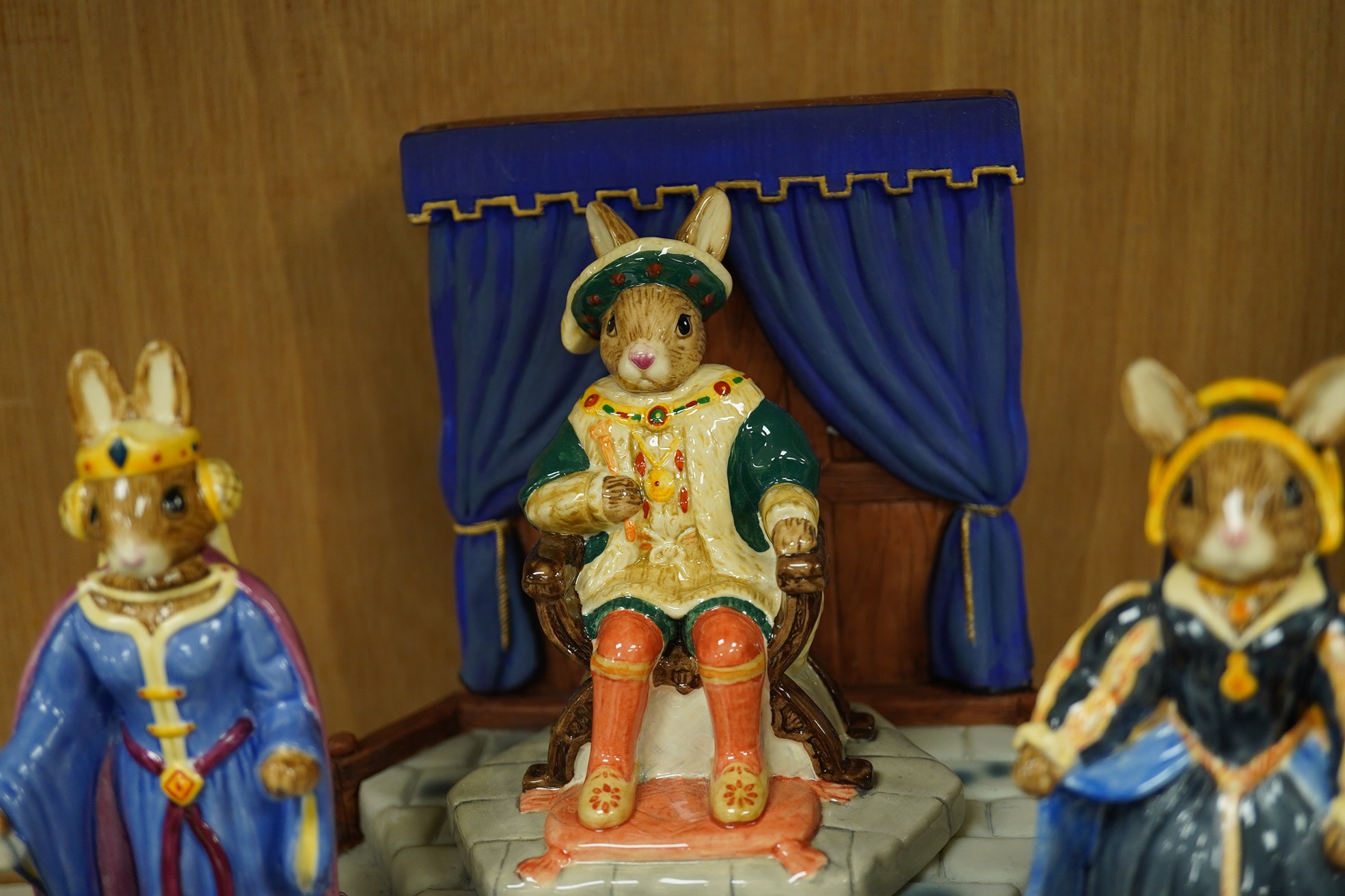 A Royal Doulton, Bunnykins, Tudor Collection, stand and nine characters (all boxed). Condition - good